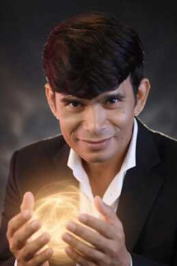 Magician Sooraj holding a glowing sphere symbolizing perception and mental influence